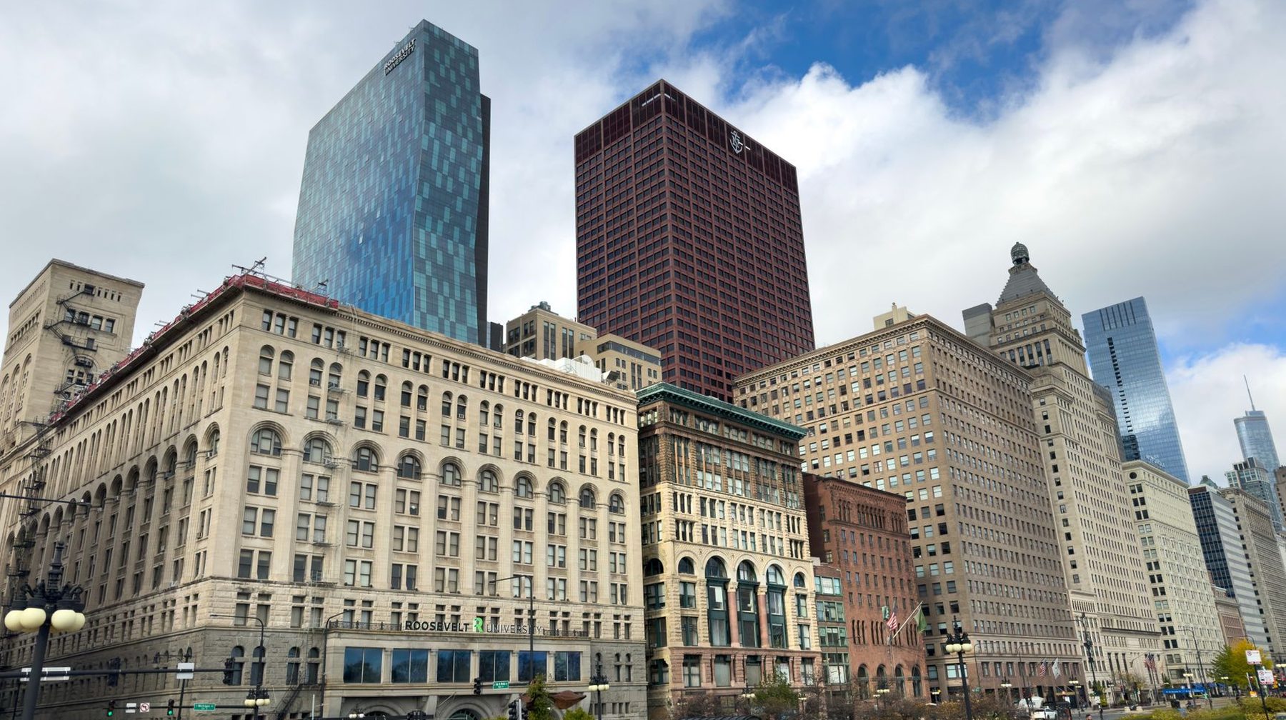 The Chicago skyline rising behind older low rise buildings